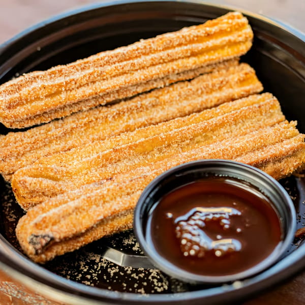 La Penca Azul's churros, coated in cinnamon sugar, served with a side of chocolate dipping sauce.